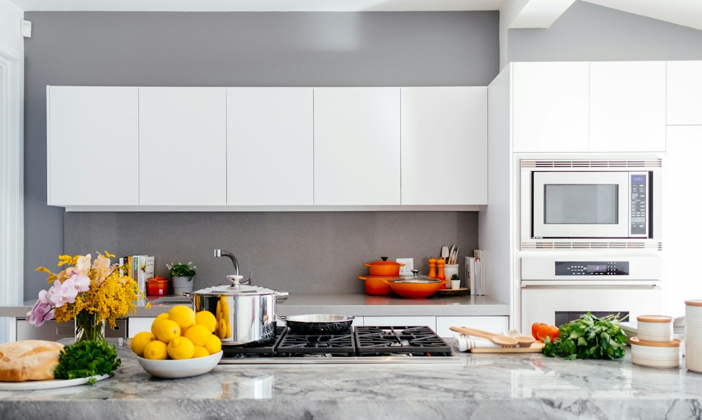 A warm, busy kitchen where fresh ingredients are prepared